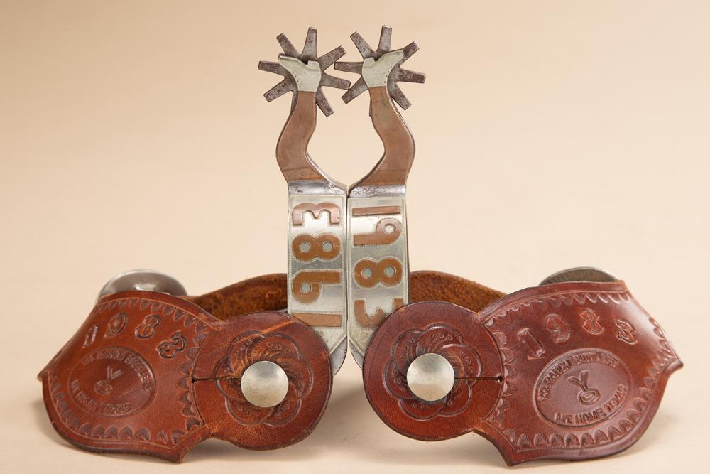 Very desirable pair of double mounted gal leg Spurs commemorating 1983. Spurs are double mounted: Very desirable pair of double mounted gal leg Spurs commemorating 1983. Spurs are double mounted with copper and silver overlaid, all hand engraved, heel bands are overlaid with the YO brand in copper