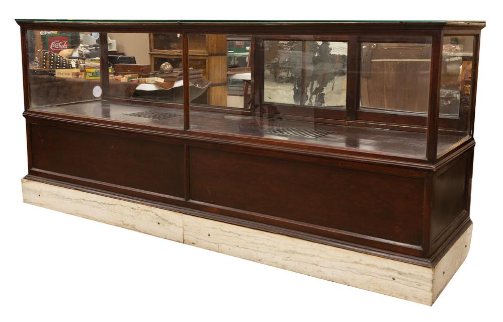 High quality antique, 8 ft. long beveled glass Humidor in mahogany case with marble front base,: High quality antique, 8 ft. long beveled glass Humidor in mahogany case with marble front base, circa 1890-1900, measures 26" deep x 42 1/2" tall with sliding glass doors and rear entry. Original fini