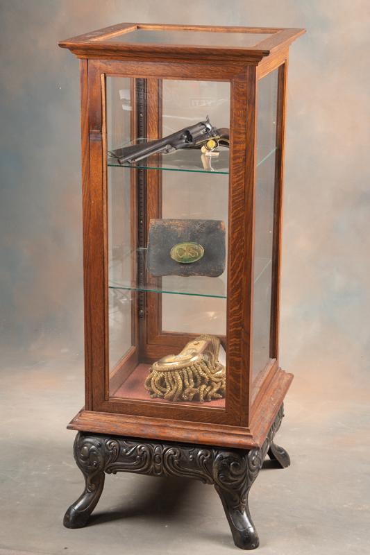 Unique two piece oak and glass Display Case with heavy embossed cast iron footed base, excellent: Unique two piece oak and glass Display Case with heavy embossed cast iron footed base, excellent condition with adjustable shelves and locking door, manufactured by J. W. Winchester, measures 20" sq. 