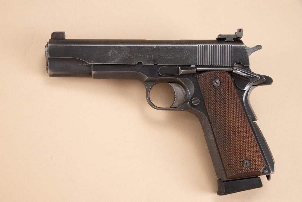 Colt Government Model 1911 Semi-Automatic Pistol, .45 ACP caliber, SN 254625-C, blue finish, 5": Colt Government Model 1911 Semi-Automatic Pistol, .45 ACP caliber, SN 254625-C, blue finish, 5" barrel, custom trigger, adjustable rear sight, original walnut checkered grips with magazine extender. R