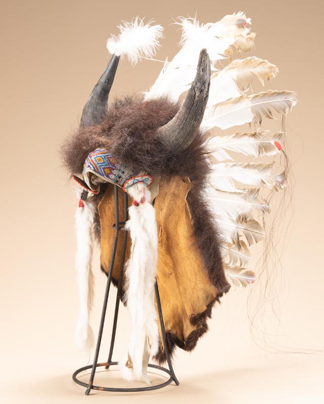 Contemporary Headdress with Buffalo horns and Buffalo cape. The type of headdress used in the movies: Contemporary Headdress with Buffalo horns and Buffalo cape. The type of headdress used in the movies such as Dancing with Wolves. Comes with a metal stand.