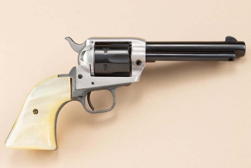 Colt Frontier Scout Single Action Revolver, .22 LR caliber, SN 143132F, blue finish with stainless: Colt Frontier Scout Single Action Revolver, .22 LR caliber, SN 143132F, blue finish with stainless receiver, 4 1/2" barrel with faux pearl grips, overall good condition, showing some discoloring on fr