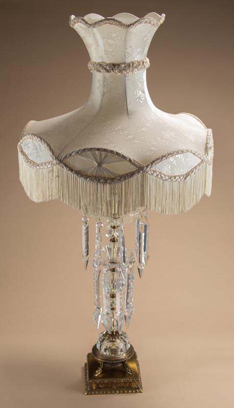 A beautiful Crystal Lamp with hand cut prisms, circa 1940s, with dolphins on base, crystal portion: A beautiful Crystal Lamp with hand cut prisms, circa 1940s, with dolphins on base, crystal portion of this lamp measures 24 1/2" tall with fragile French style shade. One prism is missing from this la