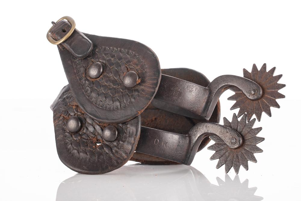 Pair of early "OK" marked Iron Spurs by Buermann (1842-1928), marking is very visible, mounted with: Pair of early "OK" marked Iron Spurs by Buermann (1842-1928), marking is very visible, mounted with a pair of vintage two-piece straps. KING COLLECTION