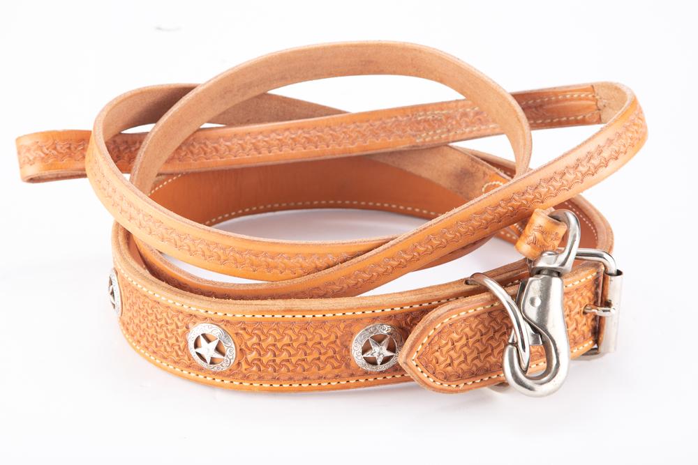 Two-piece "Buddie Foster" marked, custom made hand tooled leather Lead Leash, includes collar with: Two-piece "Buddie Foster" marked, custom made hand tooled leather Lead Leash, includes collar with raised conchos and 6 1/2 ft. lead leash. In like new condition. From the late Carolyn Jackson-Hardy M