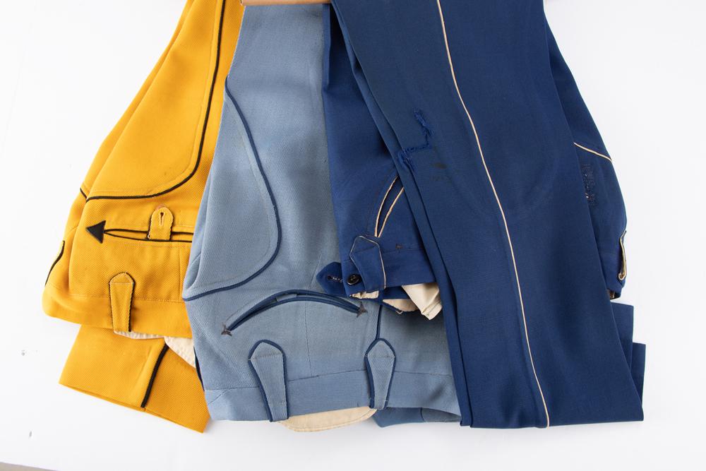 Three pair of vintage Nathan Turk Western Dress Slacks with piping 2 pair with smiley pockets. All: Three pair of vintage Nathan Turk Western Dress Slacks with piping 2 pair with smiley pockets. All have some light pest damage. Slacks are yellow, blue and light blue. WILL BE SOLD AS ONE LOT. From th