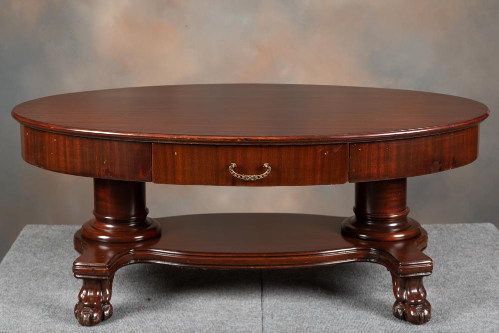 Beautiful oval, claw foot mahogany Coffee Table, circa 1910, measures 48" long top x 28" across x: Beautiful oval, claw foot mahogany Coffee Table, circa 1910, measures 48" long top x 28" across x 19" T with drawered skirt. KING COLLECTION