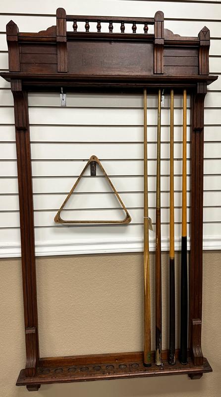 Antique walnut wall model Pool Cue Rack, marked "B. A. Stevens, Toledo, O., Billiard Tables and: Antique walnut wall model Pool Cue Rack, marked "B. A. Stevens, Toledo, O., Billiard Tables and Billiard Supplies", nice original finish, will hold 12 cue sticks. Will be accompanied by four cue stick