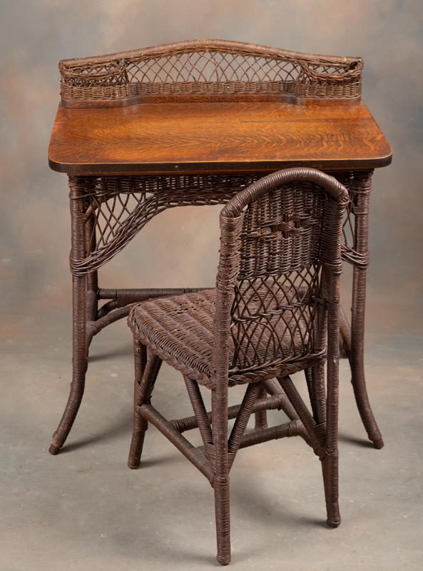 Antique two-piece Wicker Writing Desk and matching Chair. Desk has quarter sawn oak top. Desk: Antique two-piece Wicker Writing Desk and matching Chair. Desk has quarter sawn oak top. Desk measures 30" W x 18" D x 30" T. Desk and Chair will be sold as one lot. KING COLLECTION