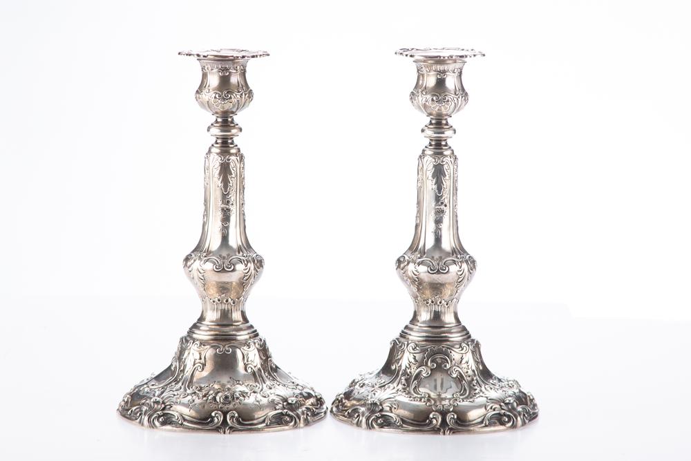 Matching pair of beautiful "Sterling" silver marked Candle Sticks, 11" T x 6" diameter base. Heavily: Matching pair of beautiful "Sterling" silver marked Candle Sticks, 11" T x 6" diameter base. Heavily embossed with roses, leaf and vine, marked on bottom "Spaulding Co., Chicago / A6436". WILL BE SOLD