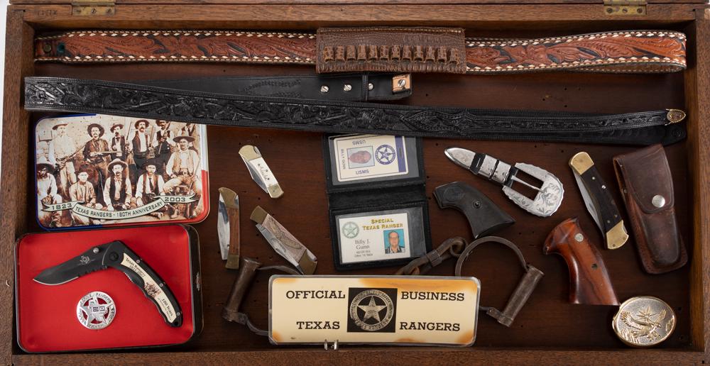 Collection of 15 items once belonging to Texas Ranger Bill Gunn in a lift top, glass top Showcase to: Collection of 15 items once belonging to Texas Ranger Bill Gunn in a lift top, glass top Showcase to include: Single blade Buck Knife with leather Holster; Pair of large frame S&W Grips; Pair of hard