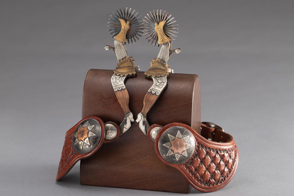 Outstanding pair of "L&M" marked double mounted, double gal-leg Spurs, showing beautiful engraving: Outstanding pair of "L&M" marked double mounted, double gal-leg Spurs, showing beautiful engraving with 2" multi-point rowels, etched buttons. Spurs are mounted with a pair of two-piece "L&M" marked s