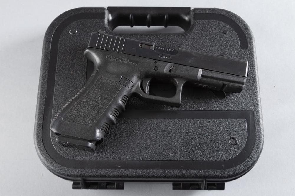 Factory boxed Glock 22 Semi-Automatic Pistol, .40 caliber, SN GXW189, matte finish, 4" barrel, in: Factory boxed Glock 22 Semi-Automatic Pistol, .40 caliber, SN GXW189, matte finish, 4" barrel, in near new condition showing very light use. Sold in original hard carry case with cleaning rod and manu