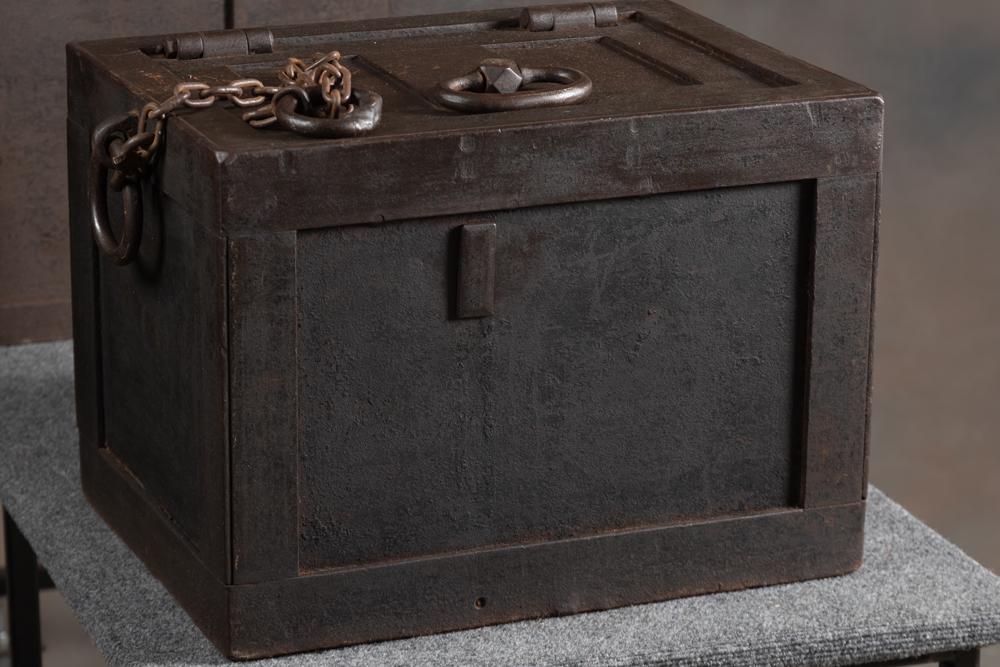 Antique Railway Express Iron Strong Box, SN 3704, appears to be in original finish and patina with: Antique Railway Express Iron Strong Box, SN 3704, appears to be in original finish and patina with original iron handles and chain. Strong Box measures 20" L x 15" W x 14 3/4" T, does show some origin