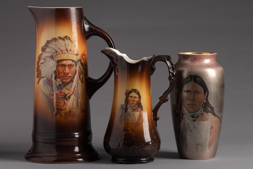 This lot consists of three items. Two Pitchers are marked "Warwick", the Lustre Ware Vase is: This lot consists of three items. Two Pitchers are marked "Warwick", the Lustre Ware Vase is unmarked, all three pieces have American Indian motif. Tall Pitcher measures 12 3/4" T x 6 1/4" Dia. at bas