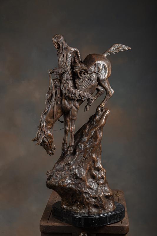 Large bronze Sculpture titled "The Mountain Man" marked "Copyright Frederic Remington". Bronze: Large bronze Sculpture titled "The Mountain Man" marked "Copyright Frederic Remington". Bronze measures 36" T x 12" x 14" polished marble base, depicting mountain man on horseback with all his trappin