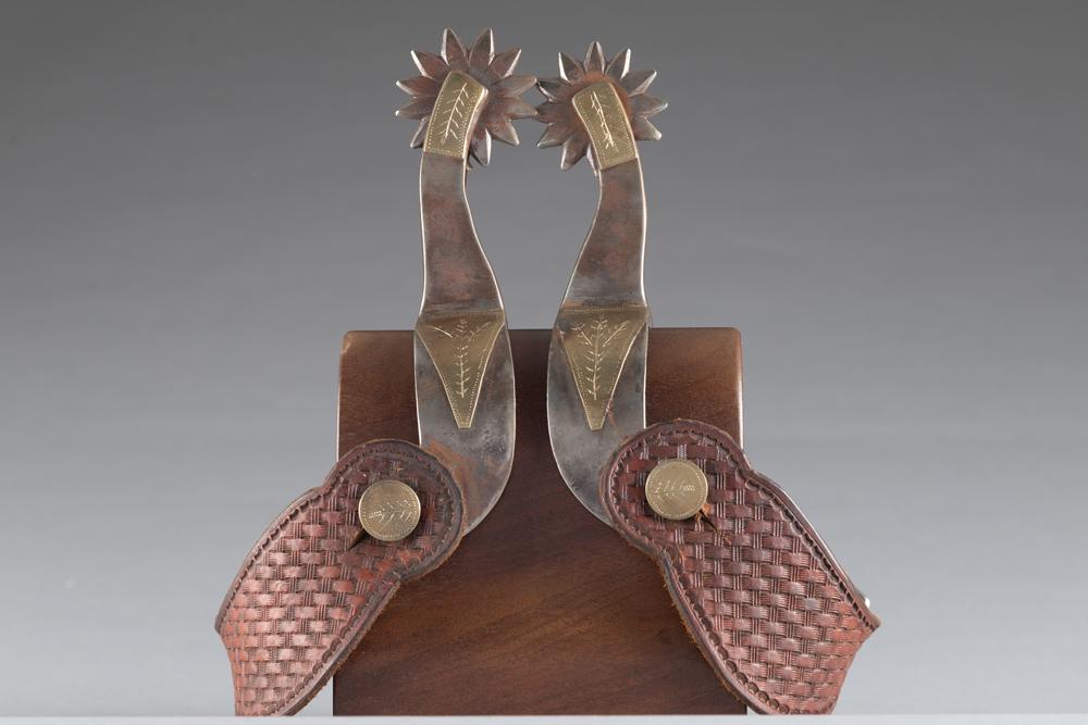 Pair of large double mounted Spurs by the late Comanche, Texas Bit and Spur Maker Carl Hall with: Pair of large double mounted Spurs by the late Comanche, Texas Bit and Spur Maker Carl Hall with hand engraved overlay in the J.O. Bass style with card suits, 1 3/8" wide heel bands, etched fixed butt