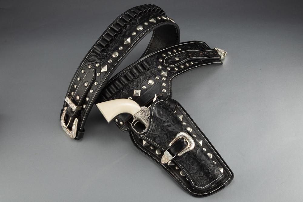 Beautiful highly tooled and spotted black Holster Rig custom made by "D. A. D. Custom Leather",: Beautiful highly tooled and spotted black Holster Rig custom made by "D. A. D. Custom Leather", marked for a .44 or .45 caliber bullet for a 5 1/2" revolver. Rig has fancy silver buckles with spots an