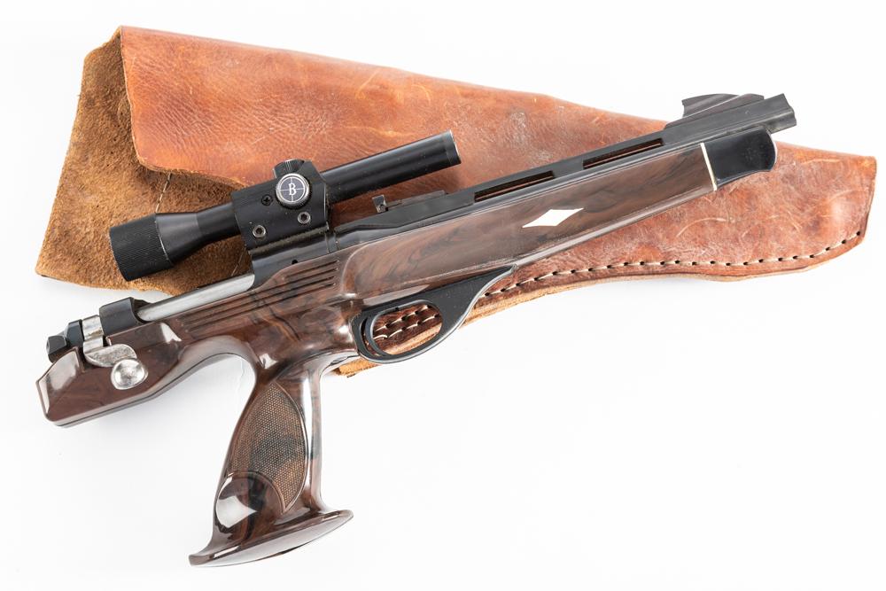 Remington Model XP-100 Single Shot Bolt Action Pistol, .221 REM FIRE BALL caliber, SN 5509, blue: Remington Model XP-100 Single Shot Bolt Action Pistol, .221 REM FIRE BALL caliber, SN 5509, blue finish, 12" vented barrel. Mounted with a Burris Scope, plastic target grips. White diamond missing at
