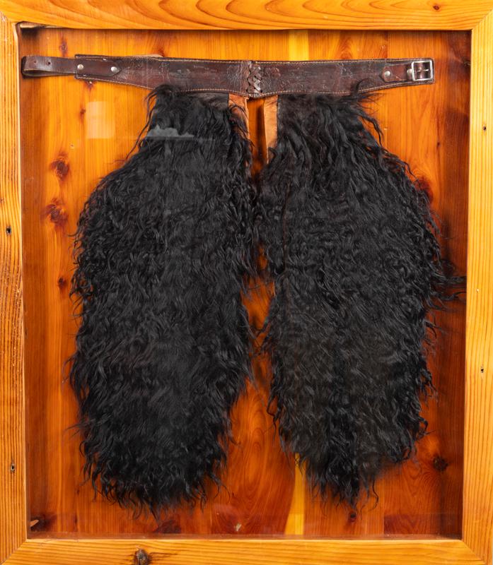 Framed pair of vintage child's Angora Woolly Chaps embossed lettering on belt reads "Lasso 'Em: Framed pair of vintage child's Angora Woolly Chaps embossed lettering on belt reads "Lasso 'Em Bill", circa 1920, shadow box frame measures 29 1/2" W x 33 1/2" T.