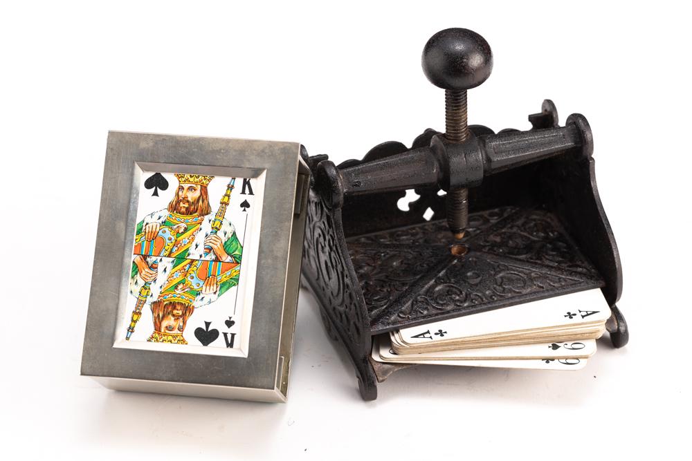 This lot consists of the following two Items: (1) A vintage heavily embossed footed cast iron Card: This lot consists of the following two Items: (1) A vintage heavily embossed footed cast iron Card Press, 4 1/2" W x 4" D x 4 1/2" T, nice original patina, one corner of the flat press portion is miss
