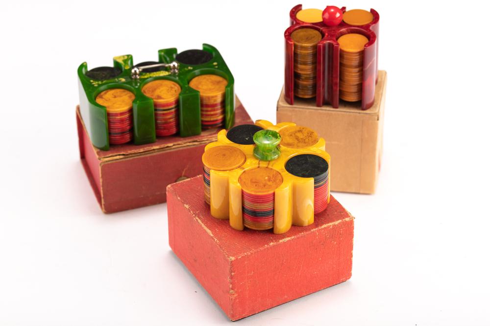 Collection of three vintage Bake-Lite Poker Chip Holders, circa 1900-1910, in original vintage: Collection of three vintage Bake-Lite Poker Chip Holders, circa 1900-1910, in original vintage boxes. Each set contains over 100 multi-color chips. WILL BE SOLD AS ONE LOT.