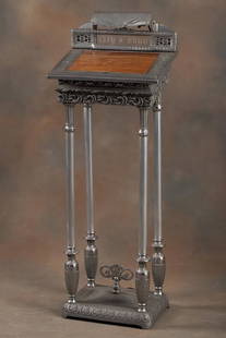 Antique Registry Stand with etched glass panel marked "CITY-DRUG", four heavily embossed metal: Antique Registry Stand with etched glass panel marked "CITY-DRUG", four heavily embossed metal columns that support a lighted slant top / lift top surface, circa 1920s, measures 50" T x 15" W x 14"