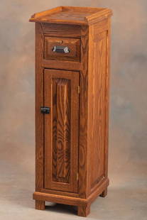 Unique oak Stand for a Model 211 or Model 313 brass National Cash Register in excellent finish and: Unique oak Stand for a Model 211 or Model 313 brass National Cash Register in excellent finish and condition with raised panel sides and front, full length drawer and single door, sold with key.