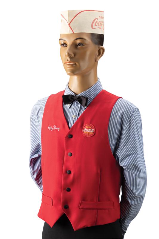 Vintage Soda Fountain Jerk Mannequin, circa 1930s with red vest marked "City Drug". This is the: Vintage Soda Fountain Jerk Mannequin, circa 1930s with red vest marked "City Drug". This is the mannequin Buddy & Paulette used in the Soda Fountain. Mannequin is on an adjustable metal stand, measure