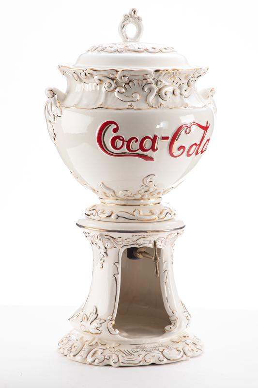 Three piece replica of an original iconic Coca-Cola Syrup Dispenser. The original was manufactured: Three piece replica of an original iconic Coca-Cola Syrup Dispenser. The original was manufactured 1896. This one we believe to be circa 1960s. Measures 11" diameter x 22" T. Very desirable item. BUDD
