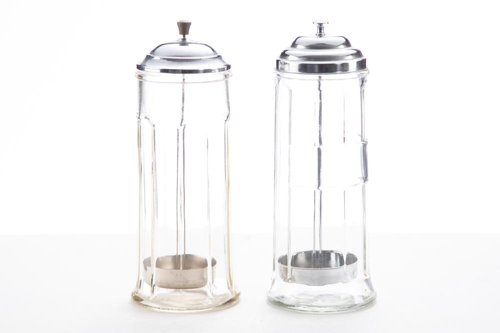 THIS LOT WILL BE SOLD 2 TIMES YOUR BID, MEANING YOUR FINAL BID WILL BE MULTIPLIED BY TWO: Two: THIS LOT WILL BE SOLD 2 TIMES YOUR BID, MEANING YOUR FINAL BID WILL BE MULTIPLIED BY TWO: Two vintage pressed glass and metal lid Straw Holders. Both measure 4 1/4" diameter x 11 1/4" T. WILL BE SOLD