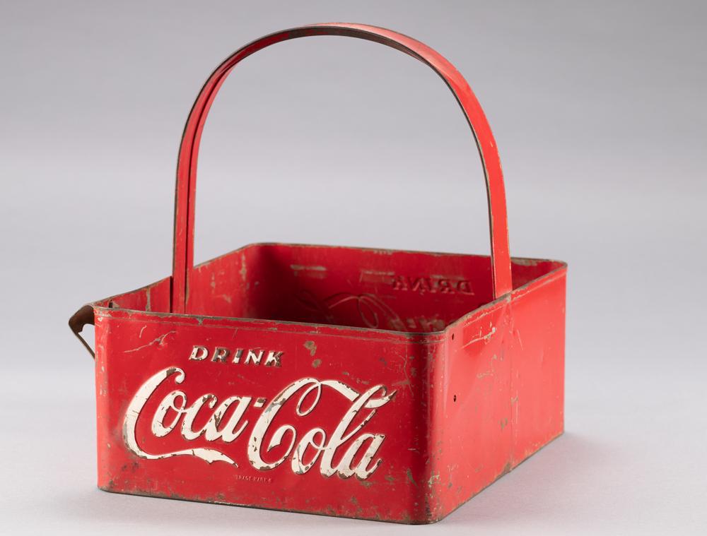 Vintage metal Coca-Cola Bottle Carrier, carries up to 20 bottles, appears to be in original paint: Vintage metal Coca-Cola Bottle Carrier, carries up to 20 bottles, appears to be in original paint with aged handling marks, bottle opener on side. Carrier measures 10 1/2" W 12" L x 13" T. BUDDY KING 