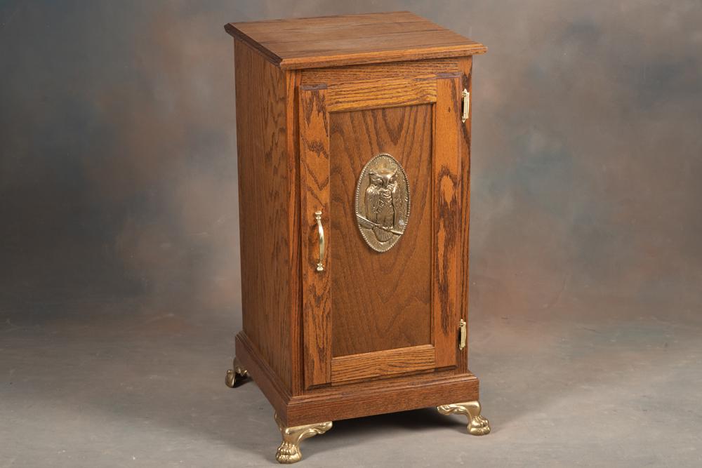 Fancy custom oak single door claw foot Side Cabinet with brass owl medallion on door and brass claw: Fancy custom oak single door claw foot Side Cabinet with brass owl medallion on door and brass claw feet, unique pull out shelf on right side, would work well for your slot machines. BUDDY KING COLLEC