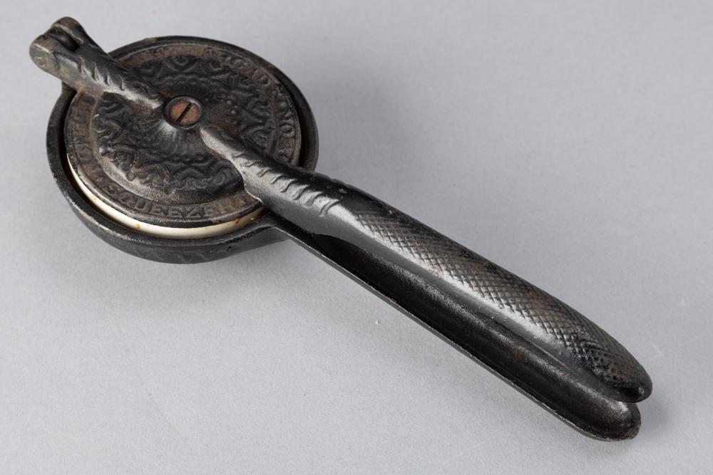 Cast iron and porcelain "Lemon Squeezer / The Arcade No. 20", heavily embossed, in original paint,: Cast iron and porcelain "Lemon Squeezer / The Arcade No. 20", heavily embossed, in original paint, measures 8 3/4" L. BUDDY KING COLLECTION