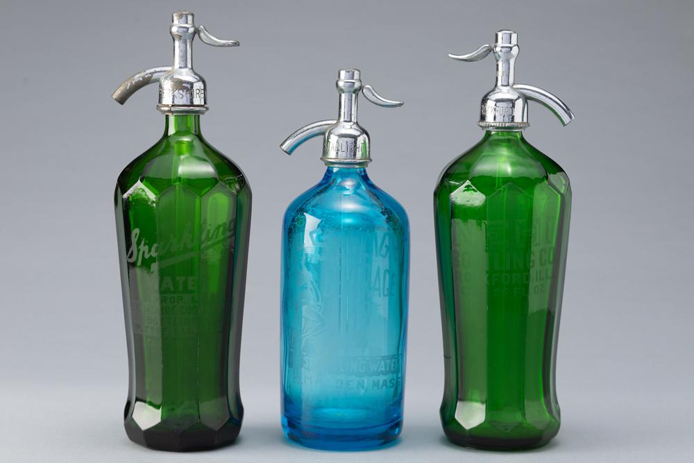 Three vintage Seltzer Bottles. One is blue and is marked "Starlight Beverage Co., Sparkling Water,: Three vintage Seltzer Bottles. One is blue and is marked "Starlight Beverage Co., Sparkling Water, Malden, Mass." and measures 11 1/4" T. One of the green Bottles is marked "Sparkling Water Prop. Of B