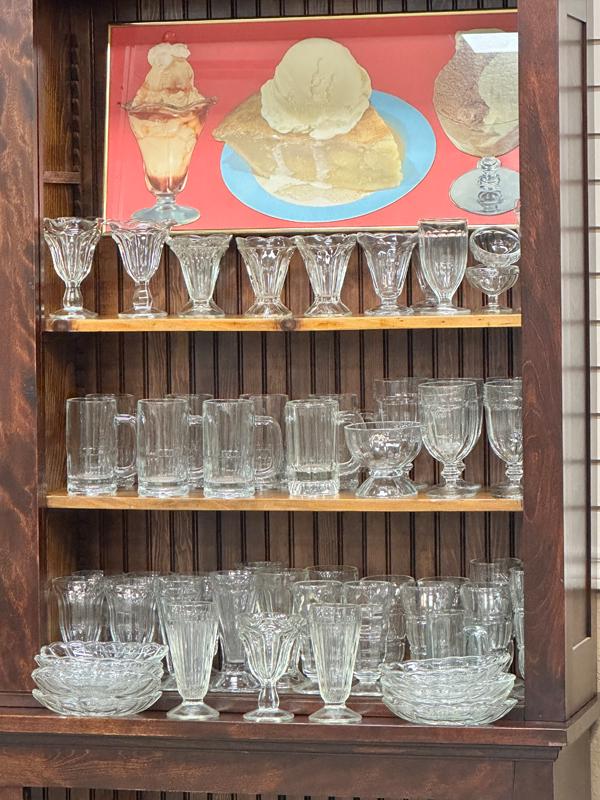Approximately 61 Pieces of Soda Fountain Glassware to include: 5 matching Tea Glasses; 22 mixed: Approximately 61 Pieces of Soda Fountain Glassware to include: 5 matching Tea Glasses; 22 mixed pattern Shake / Malt glasses; 11 Sundae Glasses; 8 matching Banana Split Boats; 8 mixed pattern Mugs; 7 