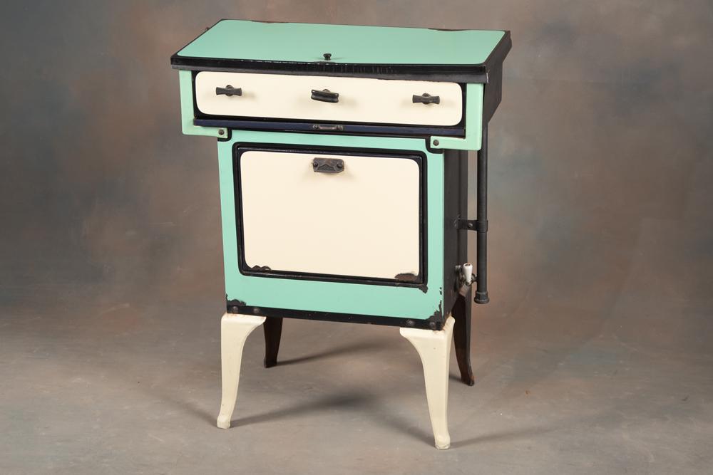 Small vintage porcelain Gas Stove, circa 1940s, with 3 burners, oven and lift up back splash,: Small vintage porcelain Gas Stove, circa 1940s, with 3 burners, oven and lift up back splash, overall good condition with some chipping in porcelain, measures 33" T x 25 1/2" W x 13" D. BUDDY KING COL
