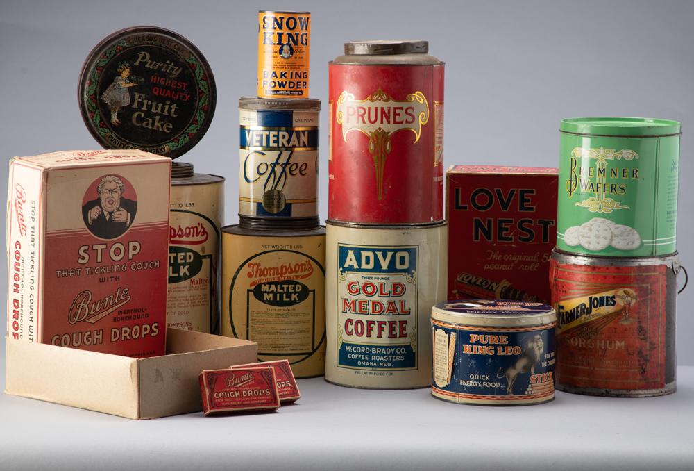 Collection of twelve (12) country store Advertising Tins to include: Two Thompson's Malted Milk Tins: Collection of twelve (12) country store Advertising Tins to include: Two Thompson's Malted Milk Tins; Veteran Coffee Tin; Prunes Tin; Purity Fruit Cake Tin; Bremner Wafers Tin; King Leo Stick Quick En