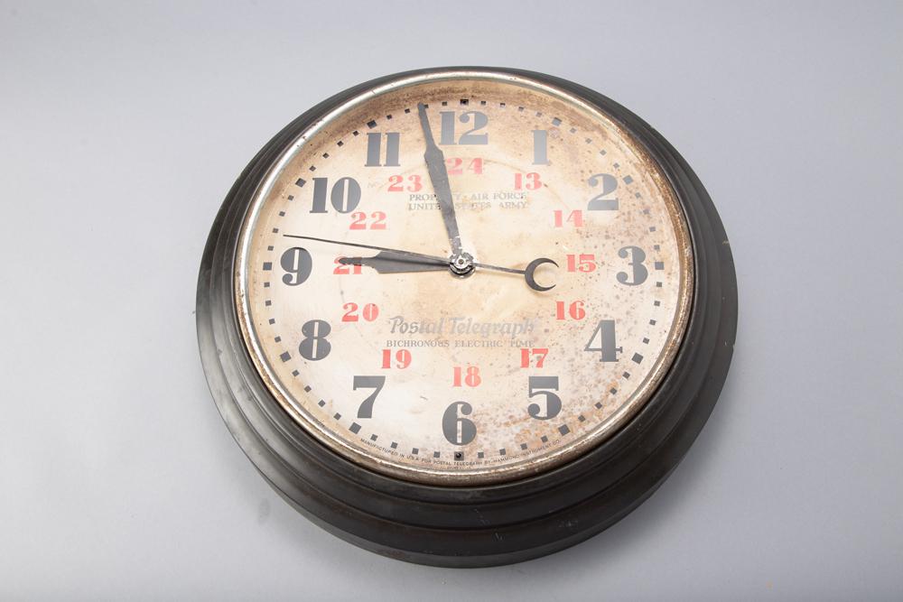 Vintage metal Electric Clock marked "Property-Air Force United States Army / Postal Telegraph: Vintage metal Electric Clock marked "Property-Air Force United States Army / Postal Telegraph Bichronous Electric Time". Clock has electric motor but has no cord, measures 20 1/2" diameter. WILL BE SO