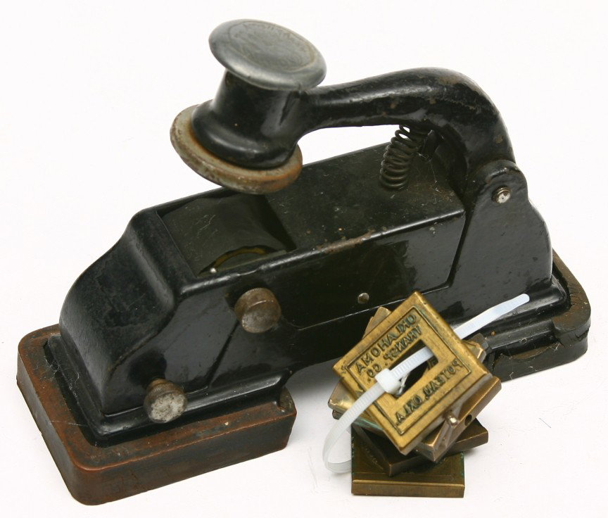 Vintage cast iron ticket validator w/ 7 brass stam: Vintage cast iron ticket validator w/ 7 brass stamp plates mostly Oklahoma marked.