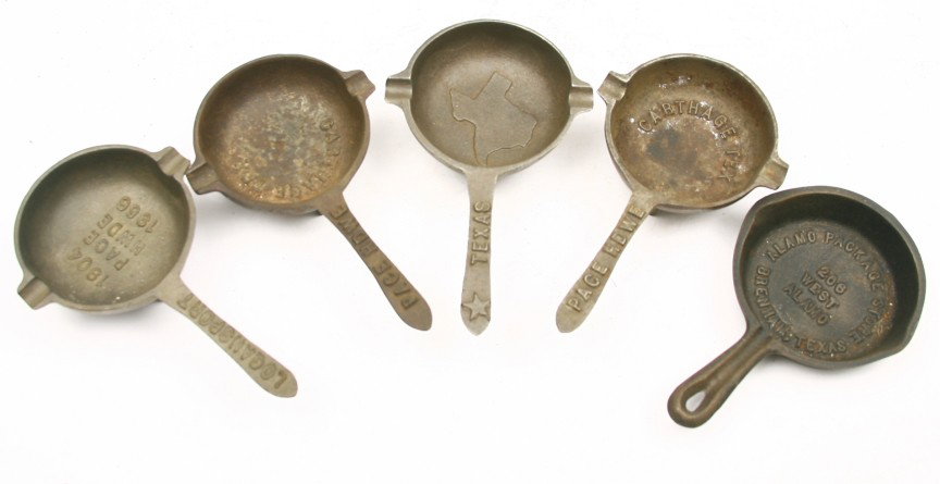 Collection of 5 vintage miniature cast iron skille: Collection of 5 vintage miniature cast iron skillets, 3 are footed: 2 Carthage, Texas - 1 Logans Port, Texas - 1 Brenham, Texas and 1 w/ embossed State of Texas. Sold as one lot.