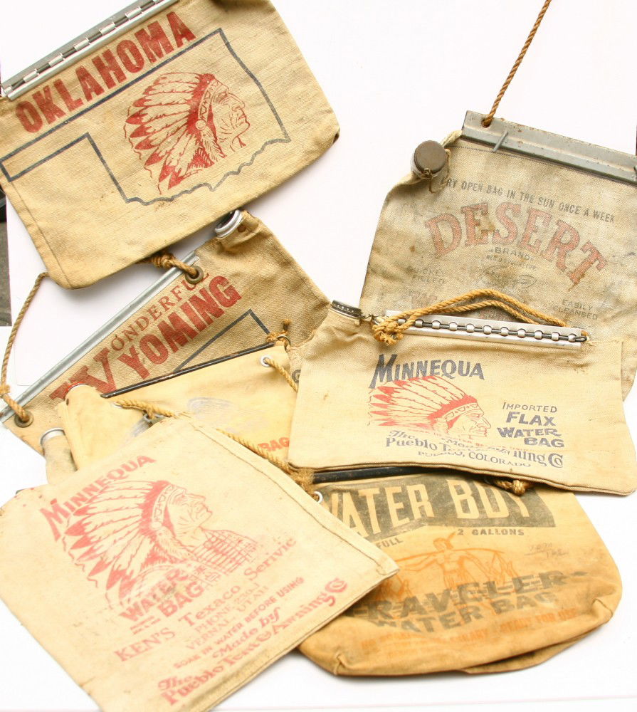Collection of 8 vintage canvas automobile desert w: Collection of 8 vintage canvas automobile desert water bags, some w/ Indian motif, good condition. Sold as one lot.
