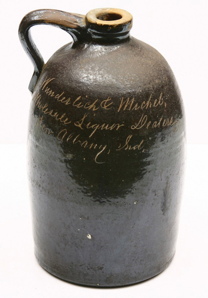 Early brown whiskey crock 12 1/2" tall for WINDERL: Early brown whiskey crock 12 1/2" tall for WINDERLICH AND MICHEL "Wholesale Liquor Dealers" NEW ABANY, IND., good condition.