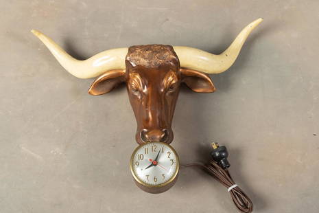 Vintage metal Steer Head Wall Clock dated 1949, manufactured by Champion Products, in working order: Vintage metal Steer Head Wall Clock dated 1949, manufactured by Champion Products, in working order at this time with red second hand. Clock horns have an 18 5/8" spread and is 16" tall, retains