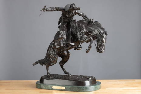 Bronze Western Sculpture with brass label on front titled "The Bronc Buster, Frederic Remington",: Bronze Western Sculpture with brass label on front titled "The Bronc Buster, Frederic Remington", measures 22" T x 20" L. Great detail with rich patina.