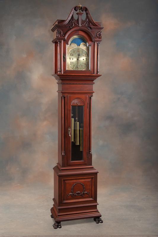 Fine vintage Seth Thomas, three weight Grandfather Clock, believed to be a Model 27, circa 1915, in: Fine vintage Seth Thomas, three weight Grandfather Clock, believed to be a Model 27, circa 1915, in carved mahogany case with lions feet, moving moon dial, stands 100" T (8 ft. 4") x 21 1/2" W at base