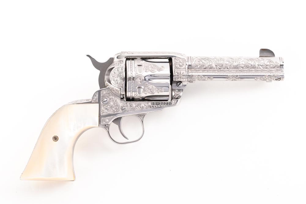Ruger Vaquero Model, .45 Colt caliber, Serial Number 55-30230, manufactured in 1997, 4 3/4" barrel.: Ruger Vaquero Model, .45 Colt caliber, Serial Number 55-30230, manufactured in 1997, 4 3/4" barrel. This beautifully heavy relief engraved Vaquero was done by now retired Master Engraver Bill Johns, w