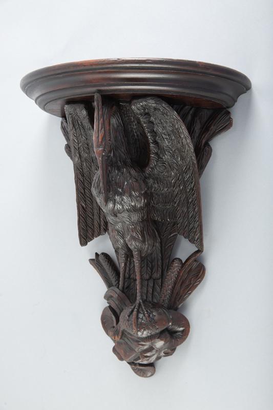 Antique Black Forest Hand Carved Wall Shelf with full carved Crane holding fish, 17 1/2" T x 13 3/4": Antique Black Forest Hand Carved Wall Shelf with full carved Crane holding fish, 17 1/2" T x 13 3/4" W x 8" half-moon shelf, circa 1890s. Beautiful carving, great detail.