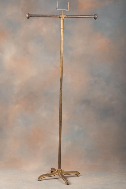 Vintage Cast Iron Floor Model Clothing Rack from an old Ft. Worth Haberdashery shop, measuring 66" T: Vintage Cast Iron Floor Model Clothing Rack from an old Ft. Worth Haberdashery shop, measuring 66" T with hanging rod 29" .