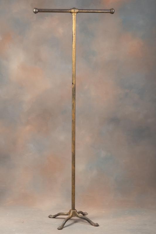 Vintage Cast Iron Floor Model Clothing Rack from an old Ft. Worth Haberdashery shop, measuring 66" T: Vintage Cast Iron Floor Model Clothing Rack from an old Ft. Worth Haberdashery shop, measuring 66" T with hanging rod 29" .